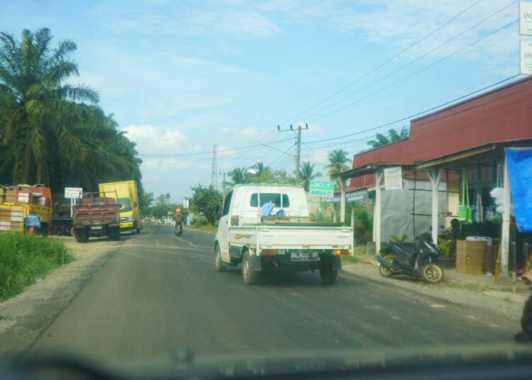 Jalan Simpang Koto Agung–Blok C Sitiung I Dharmasraya.